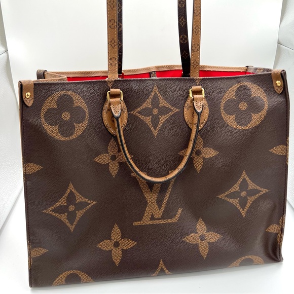 Louis Vuitton Handbags - Louis Vuitton Brown Monogram Tote with Red Interior.